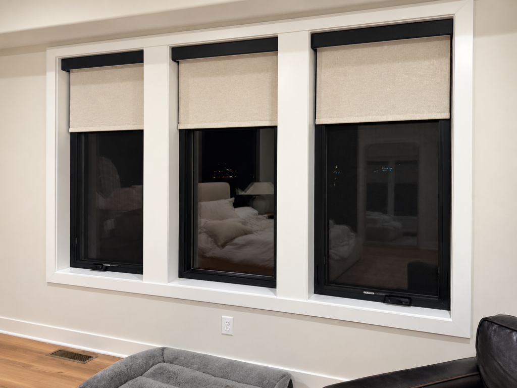 Custom roller shades installed on three windows in a Kansas City home