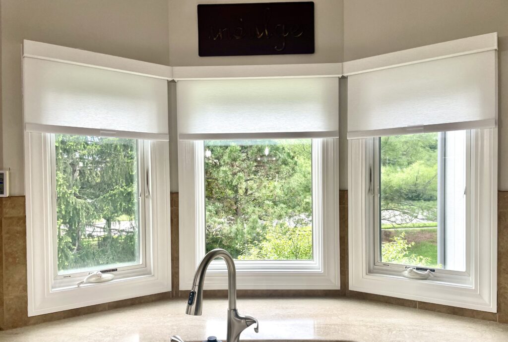 Custom roller shades on bay windows in a Kansas City home