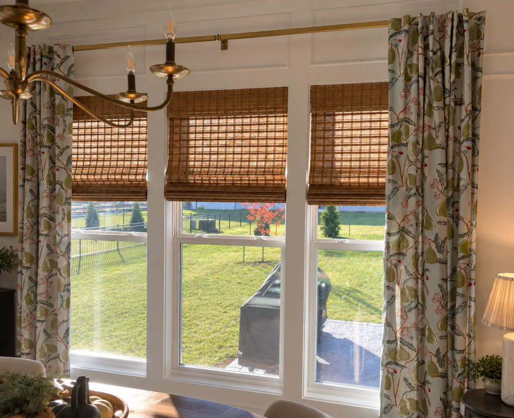 Bamboo shades paired with patterned drapes in a Kansas City home