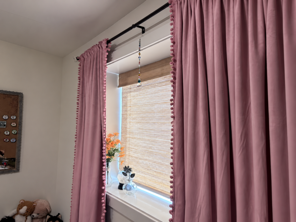 Natural woven shade paired with decorative drapes